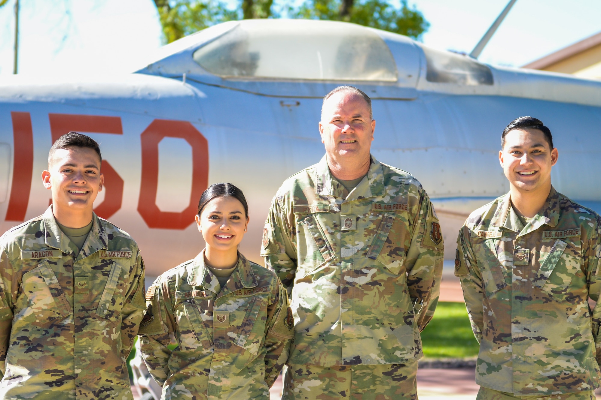 Chief Master Sgt. Pena is surrounded by his family, all members of the New Mexico Air National Guard. From left, son Airman 1st Class, Sefe Aragon, 150th Security Forces Squadron, daughter, Staff Sgt. Lindsey Aragon, 150th Operations Group, and nephew, Airman 1st Class Brandon Carrejo, 150th Operations Support Squadron. U.S. Air National Guard photo by Senior Airman Ian Beckley