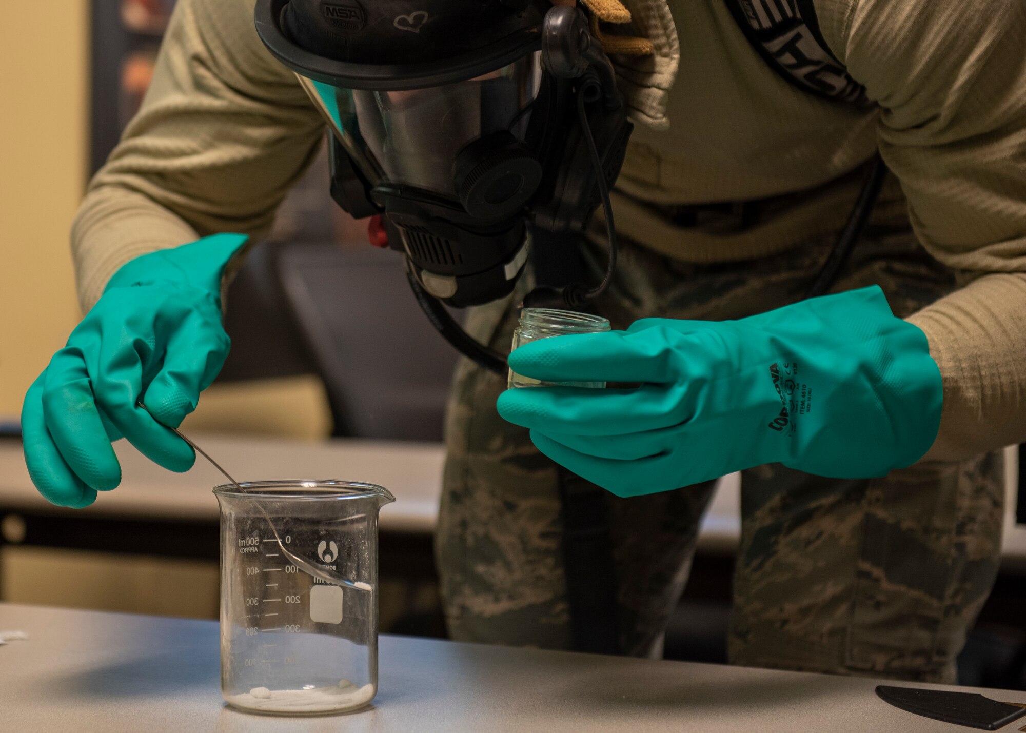 Airman 1st Class Abimanuel Valle Ramos, 4th Civil Engineer Squadron emergency manager, takes a dust sample of mock hazardous material at Seymour Johnson Air Force Base, North Carolina, Nov. 19, 2020.