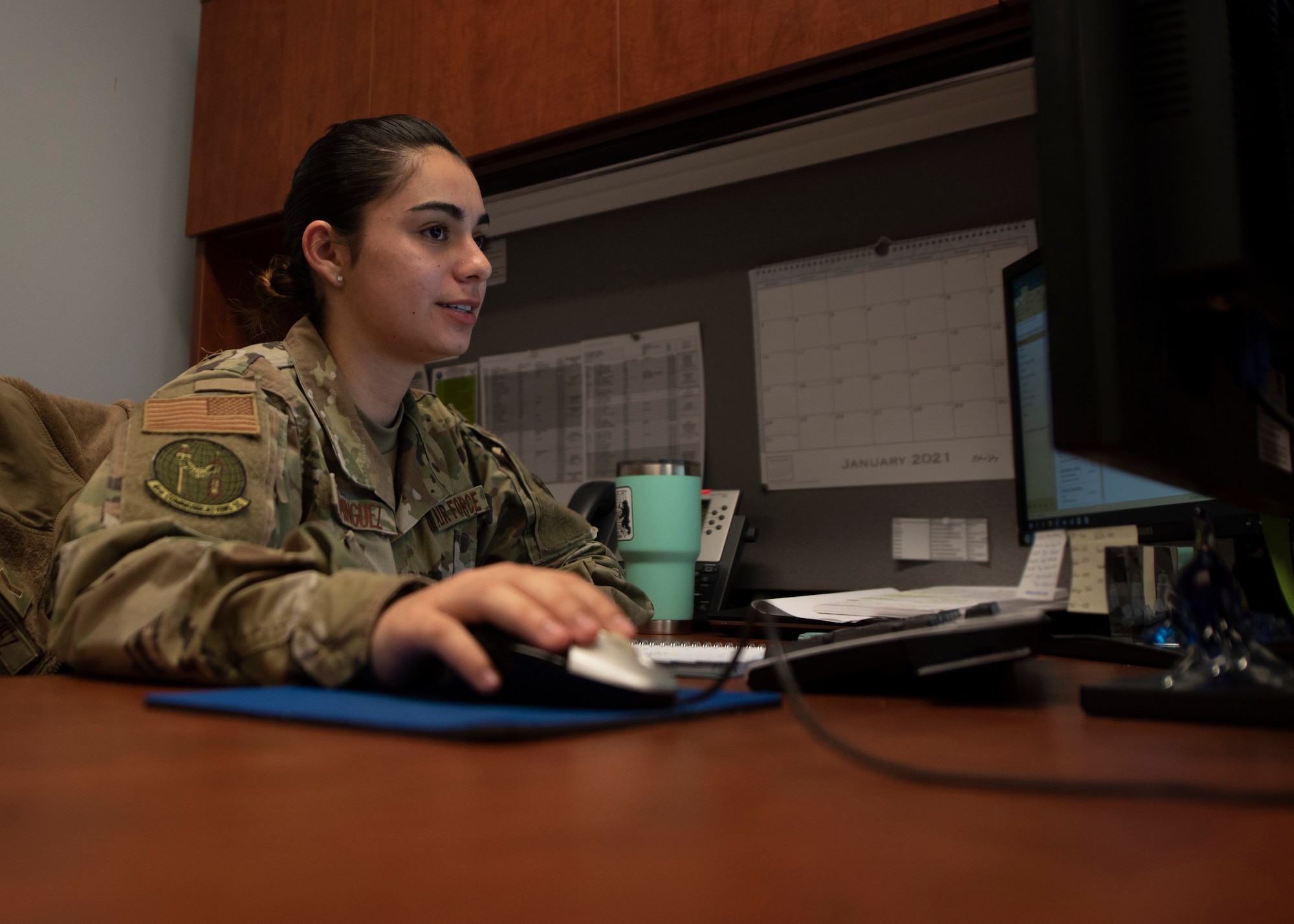 Senior Airman Patricia A. Dominguez, 4th Communications Squadron quality assurance, reviews information on a computer at Seymour Johnson Air Force Base, North Carolina, Nov. 16, 2020.