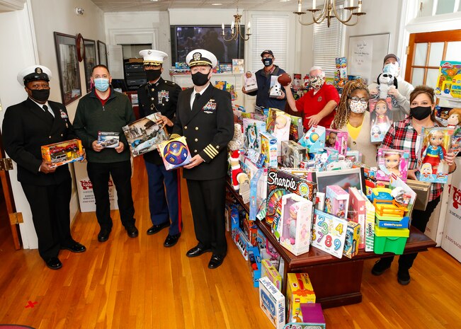 The Norfolk Naval Shipyard (NNSY) Veteran Employee Readiness Group (VET-ERG) closed out their annual Toys for Tots Collection Dec. 9, collecting 704 toys to be donated to children within the community. Members of the VET-ERG, Deputy Shipyard Commander Capt. Todd Nichols, Command Master Chief Gene Garland, and a Marine representative for Toys for Tots came together to celebrate this momentous achievement.