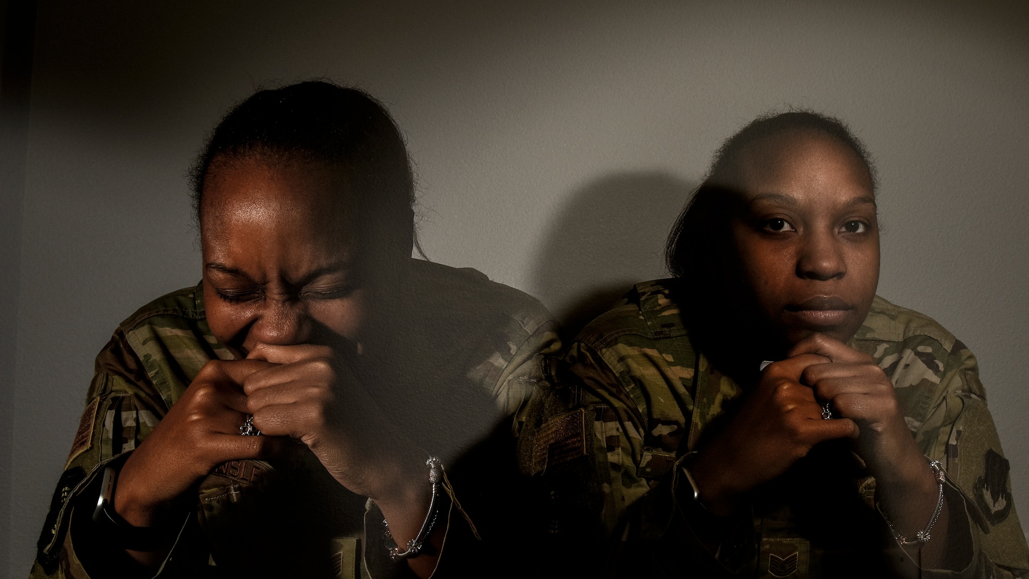 Airman sitting in the dark.