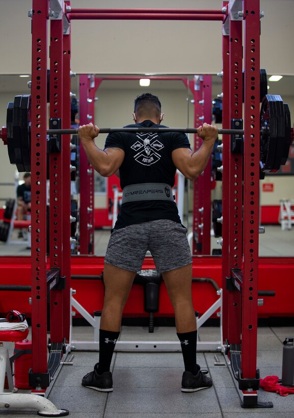 U.S. Marine Corps Sgt. John Carmona, the platoon sergeant for Communication Strategy and Operations and a supply administrations and operations specialist, executes a barbell back squat at Gunner’s Fitness Center on Camp Foster, Okinawa, Japan, Nov. 24, 2020.