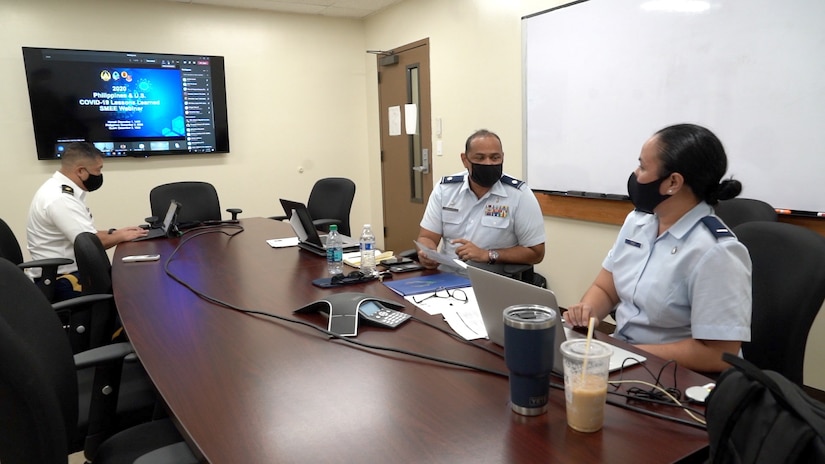 Lt. Col. James Faumuina, 154th Medical Group, Detachment 1 commander and 1st Lt Gloria Choo, international health specialist, State Partnership Program, talk during a virtual COVID-19 subject matter expert exchange between the Armed Forces of the Philippines and the Guam and Hawaii National Guard, Honolulu, Hawaii, Dec 1, 2020.