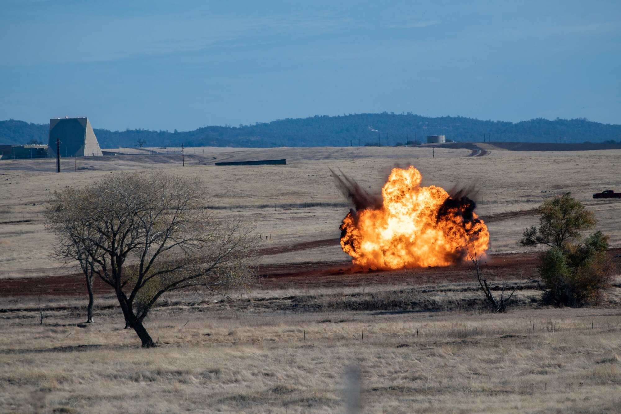Explosives, equivalent to 100 pounds of TNT, are set off during military working dog (MWD) and explosive ordnance detection collaborated training on Beale Air Force Base.