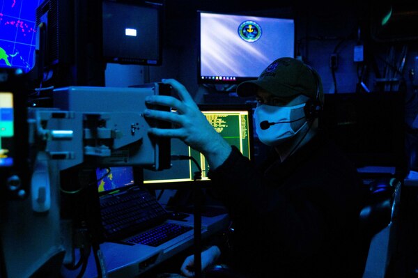 Sonar Technician (Surface) 1st Class Tyler  Davis, from Lemoore Calif., assigned to Destroyer Squadron (DESRON) 15, serves as the Sea Combat tactical watch stander during Fleet Synthetic Training - Joint (FST-J) exercise aboard USS Ronald Reagan (CVN 76). FST-J is a week-long exercise that brings together multiple units from across the globe to train together in a virtual environment. As the U.S. Navy's largest forward deployed fleet, U.S. 7th Fleet routinely operates between 50-70 ships and submarines and 140 aircraft with approximately 20,000 Sailors. 7th Fleet's area of operation spans more than 124 million square kilometers, stretching from the International Date Line to the India/Pakistan border; and from the Kuril Islands in the North to the Antarctic in the South Pacific, providing security and stability to the region. 7th Fleet interacts with 35 other maritime nations to build partnerships that foster maritime security while conducting a wide-range of missions to support humanitarian efforts and uphold international laws and freedoms of the sea. (U.S. Navy photo by Mass Communication Specialist Seaman Askia Collins. This photo has been altered for security purposes.)