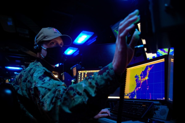 Lt. Zack Lukens, from Port Charlotte, Fla., assigned to Destroyer Squadron (DESRON) 15, serves as the Sea Combat tactical watch stander during Fleet Synthetic Training - Joint (FST-J) exercise aboard USS Ronald Reagan (CVN 76). FST-J is a week-long exercise that brings together multiple units from across the globe to train together in a virtual environment. As the U.S. Navy's largest forward deployed fleet, U.S. 7th Fleet routinely operates between 50-70 ships and submarines and 140 aircraft with approximately 20,000 Sailors. 7th Fleet's area of operation spans more than 124 million square kilometers, stretching from the International Date Line to the India/Pakistan border; and from the Kuril Islands in the North to the Antarctic in the South Pacific, providing security and stability to the region. 7th Fleet interacts with 35 other maritime nations to build partnerships that foster maritime security while conducting a wide-range of missions to support humanitarian efforts and uphold international laws and freedoms of the sea. (U.S. Navy photo by Mass Communication Specialist Seaman Askia Collins. This photo has been altered for security purposes.)