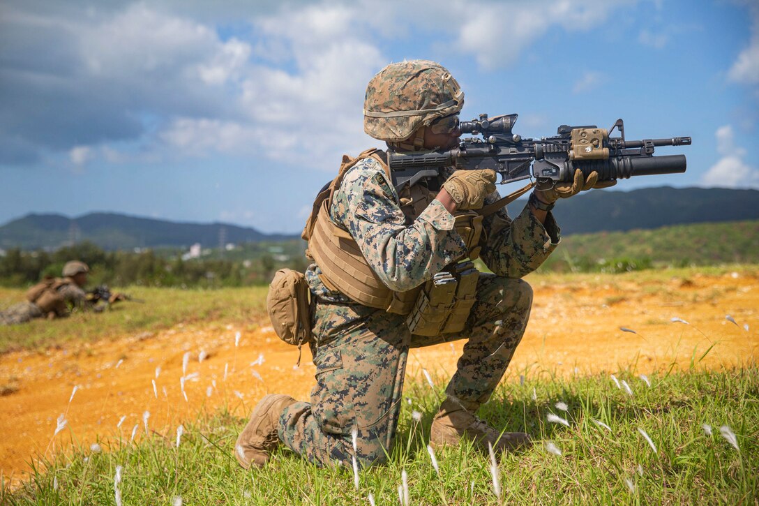 U.S. Marine Corps Lance Cpl. Addison Latimer, an infantry rifleman with 1st Battalion, 3rd Marine Regiment, attached to 3rd Marine Division, provides suppressive fire for his squad at Camp Hansen, Okinawa, Japan, Oct. 3, 2020. The tactical small unit leaders course provided an opportunity for noncommissioned officers to increase their proficiency as leaders while increasing their mental and physical toughness in the harsh jungle environment. Latimer is a native of Miami, Fla. (U.S. Marine Corps photo by Lance Cpl. Alex Fairchild)