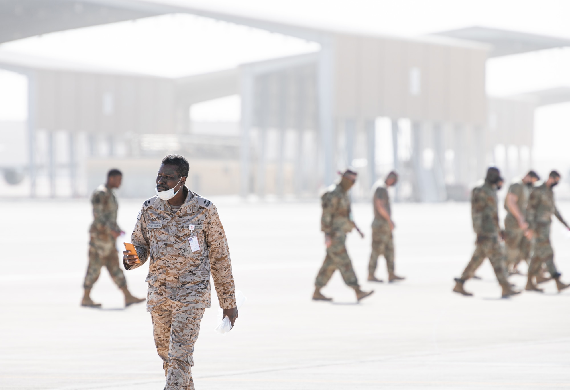 Airmen from the 378th Air Expeditionary Wing participate in a joint foreign object debris (FOD) walk with Royal Saudi Air Force personnel Dec. 7, 2020, at Prince Sultan Air Base, Kingdom of Saudi Arabia.