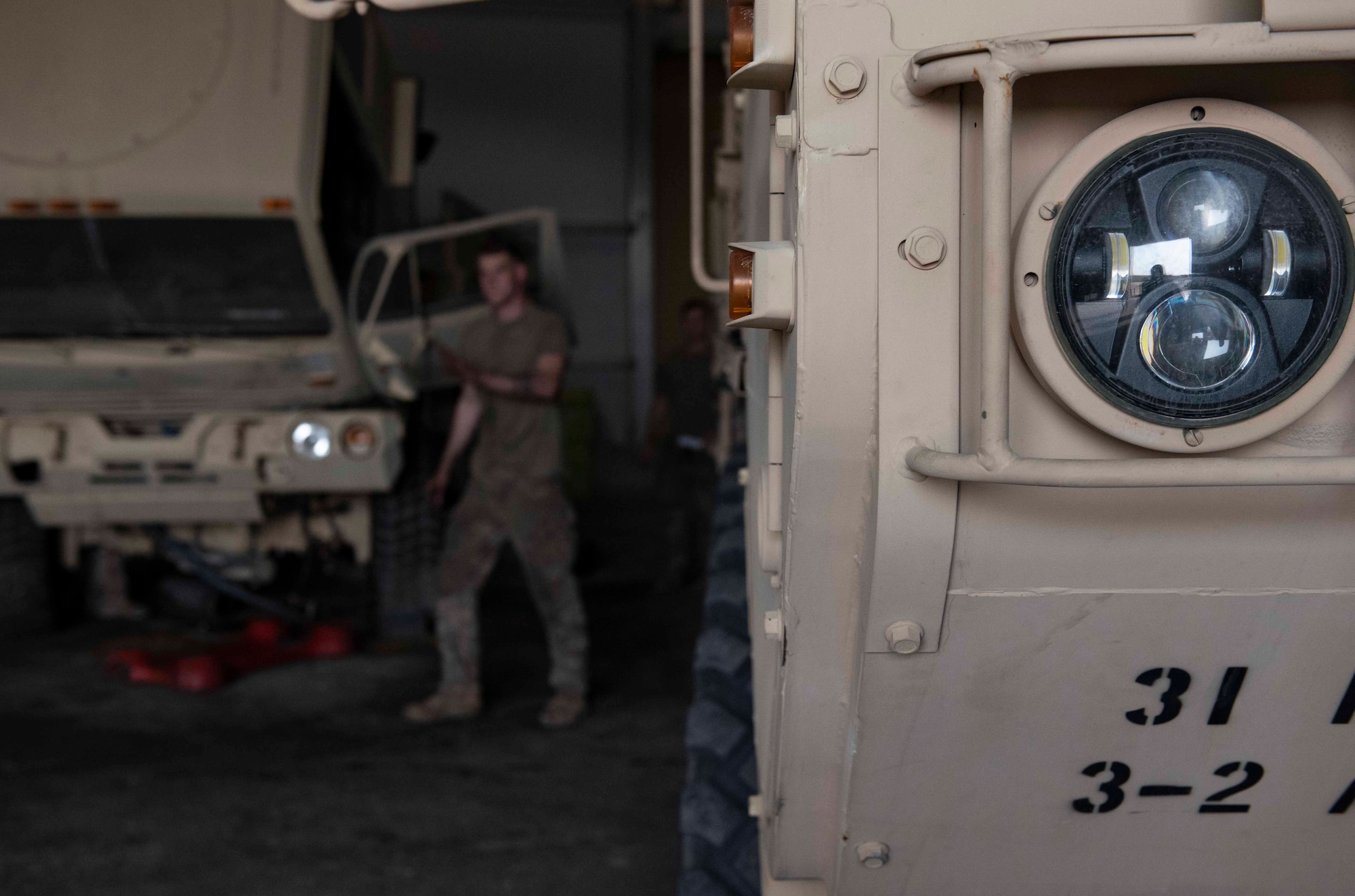 A U.S. Army Soldier assigned to Charlie Battery, 3rd Battalion, 2nd Air Defense Artillery Regiment works on an M1085A1 long-wheelbase truck engine at Ali Al Salem Air Base, Kuwait, Nov. 20, 2020. The truck provides tactical unit and cargo mobility and has a maximum payload capacity of 10,000 pounds. (U.S. Air Force photo by Staff Sgt. Kenneth Boyton)