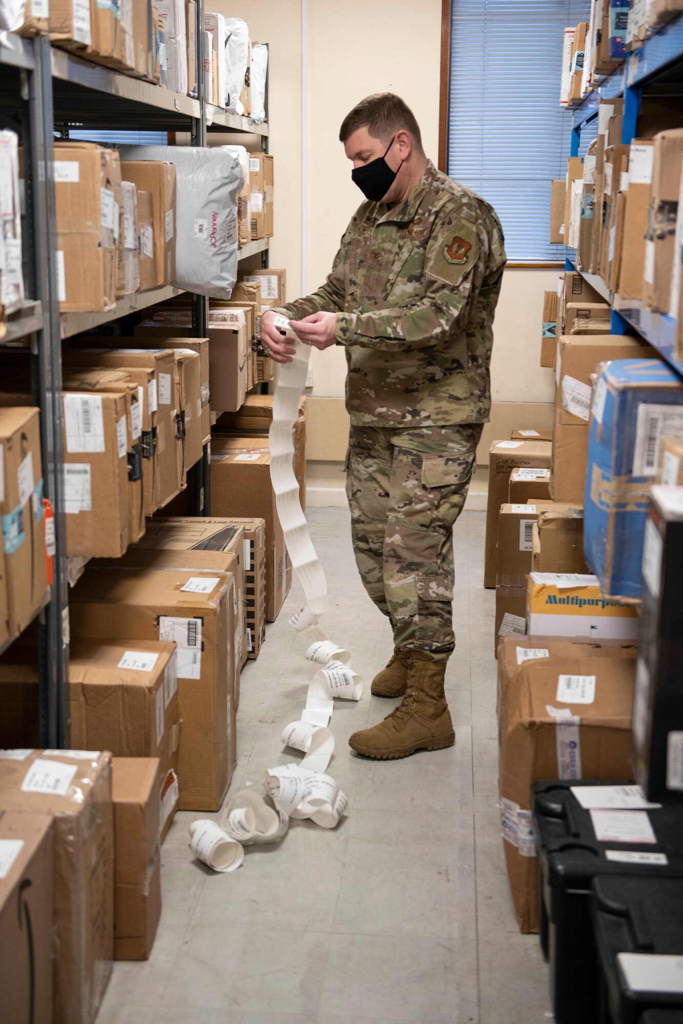 U.S. Air Force Col. Kurt Wendt, 501st Combat Support Wing commander, volunteers at the Royal Air Force Molesworth Post Office, England, Dec. 9, 2020. Airmen and civilians have volunteered at the post office to help with the influx of packages during the holiday season. (U.S. Air Force photo by Senior Airman Jennifer Zima)