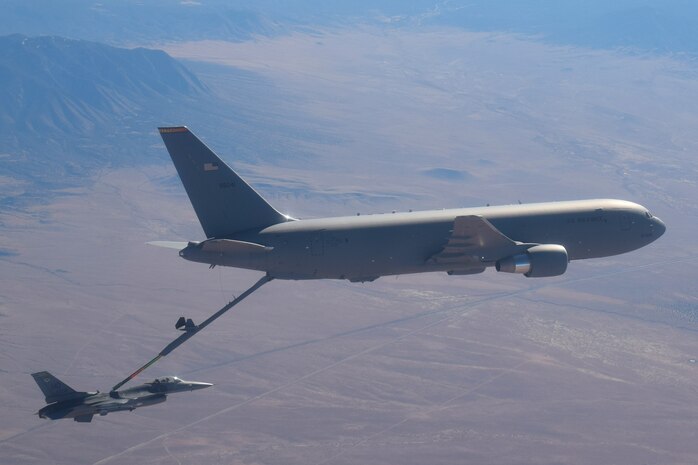 In the skies over New Mexico, an F-16 Fighting Falcon from the 49th Wing at Holloman Air Force Base (AFB), New Mexico, receives fuel from a KC-46 Pegasus from the 56th Air Refueling Squadron at Altus AFB, Oklahoma, December 7, 2020. This is the first time an Air Education and Training Command KC-46 has made contact with and transferred fuel to an F-16. (Courtesy photo by 1st Lt. Daniel Lee)