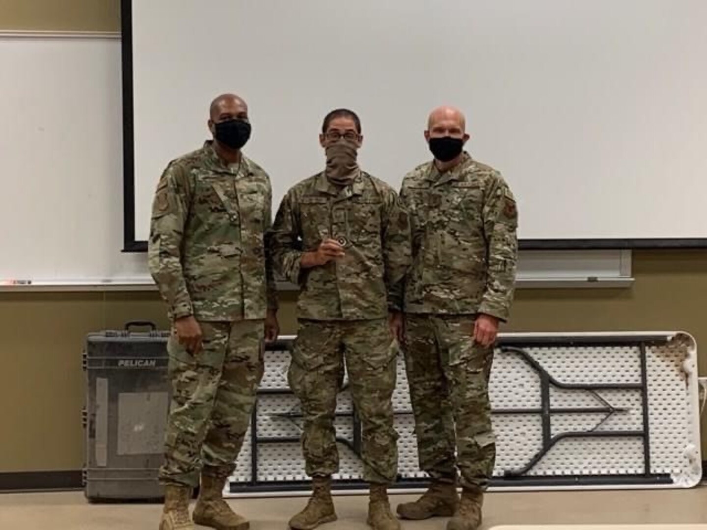 Brig. Gen. Roy W. Collins, left, Director of Security Forces, and Deputy Chief of Staff for Logistics, Engineering and Force Protection, Headquarters U.S. Air Force, and Chief Master Sgt. Lewis, right, Security Forces career field manager, recognize select Defenders with the 741st Missile Security Forces Squadron with awards and coins at Camp Guernsey Joint Training Center, Wyoming, Sept. 15, 2020. (U.S. Air Force Courtesy photo).