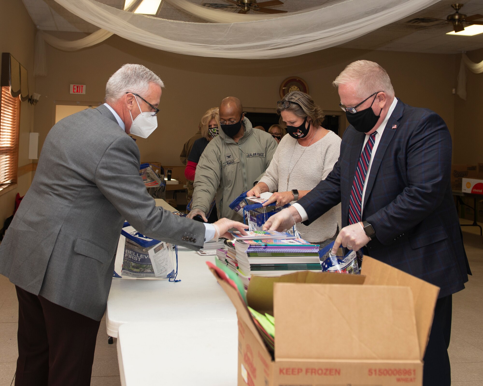 Stand alone photo of Bellevue Chamber filling holiday bags for Offutt dorm residents