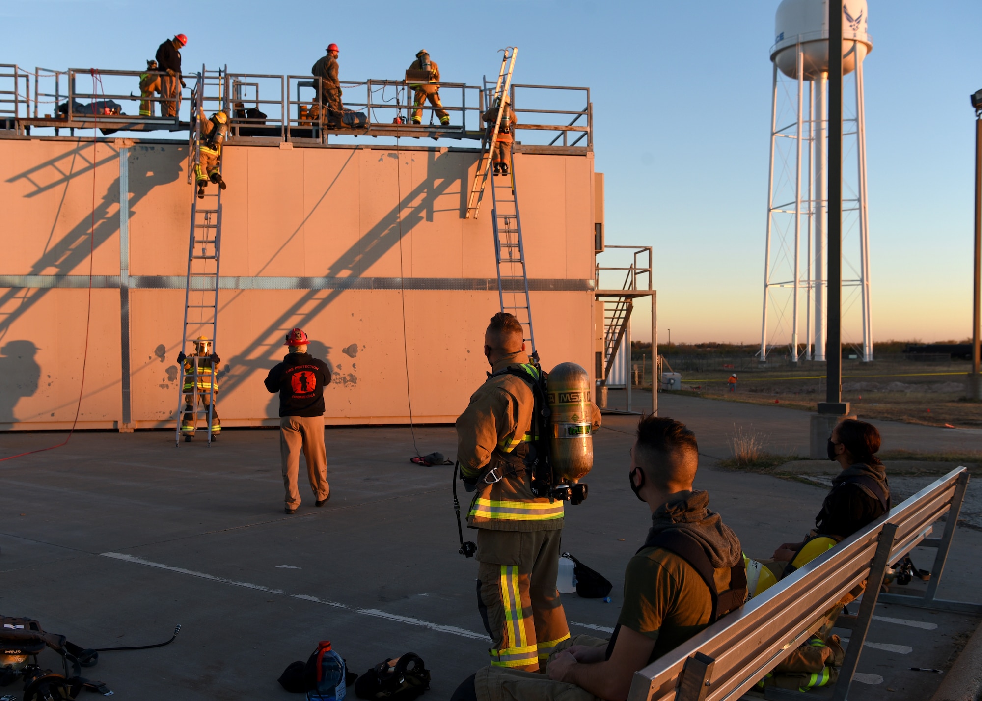 Joint services collaborate in vertical ventilation training simulations at the Louis F. Garland Department of Defense Fire Academy on Goodfellow Air Force Base, Texas, Dec. 10, 2020. The DOD fire academy provided training to uniformed and civilian members of the U.S. Army, Marine Corps, Navy, Air Force, Coast Guard, and other organizations while building partnership capacities with allied nations. (U.S. Air Force photo by Senior Airman Abbey Rieves)