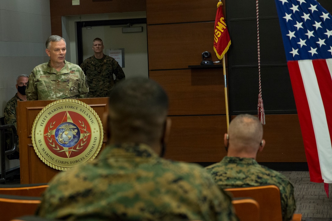 U.S. Air Force Gen. Glen D. VanHerck, Commander, North American Aerospace Defense Command and U.S. Northern Command, speaks during the U.S. Marine Corps Forces Northern Command (MARFORNORTH) transfer of authority ceremony between U.S. Marine Corps Forces Reserve and U.S. Marine Corps Forces Command (MARFORCOM), Fleet Marine Force Atlantic (FMFLANT), at Naval Support Activity Hampton Roads, Norfolk, Virginia, Dec. 8, 2020. The transfer of MARFORNORTH roles and responsibilities will enhance the mission effectiveness of the naval forces assigned to U.S. Northern Command as they conduct their primary mission of Homeland Defense through more fully integrated staff processes, and additional opportunities for integration between Navy and Marine Corps counterparts. (U.S. Marine Corps Photo by Sgt. Desmond Martin/Released)