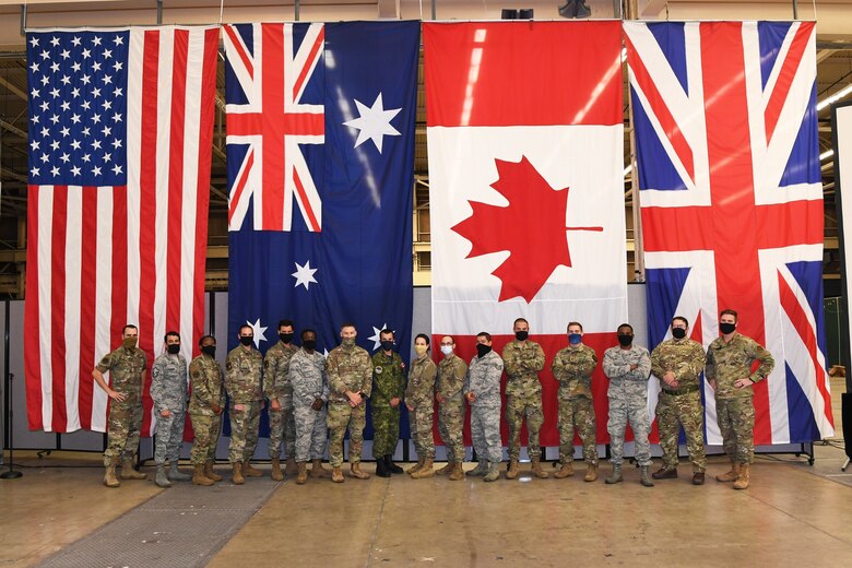 Group photo of multinational and joint military space operators