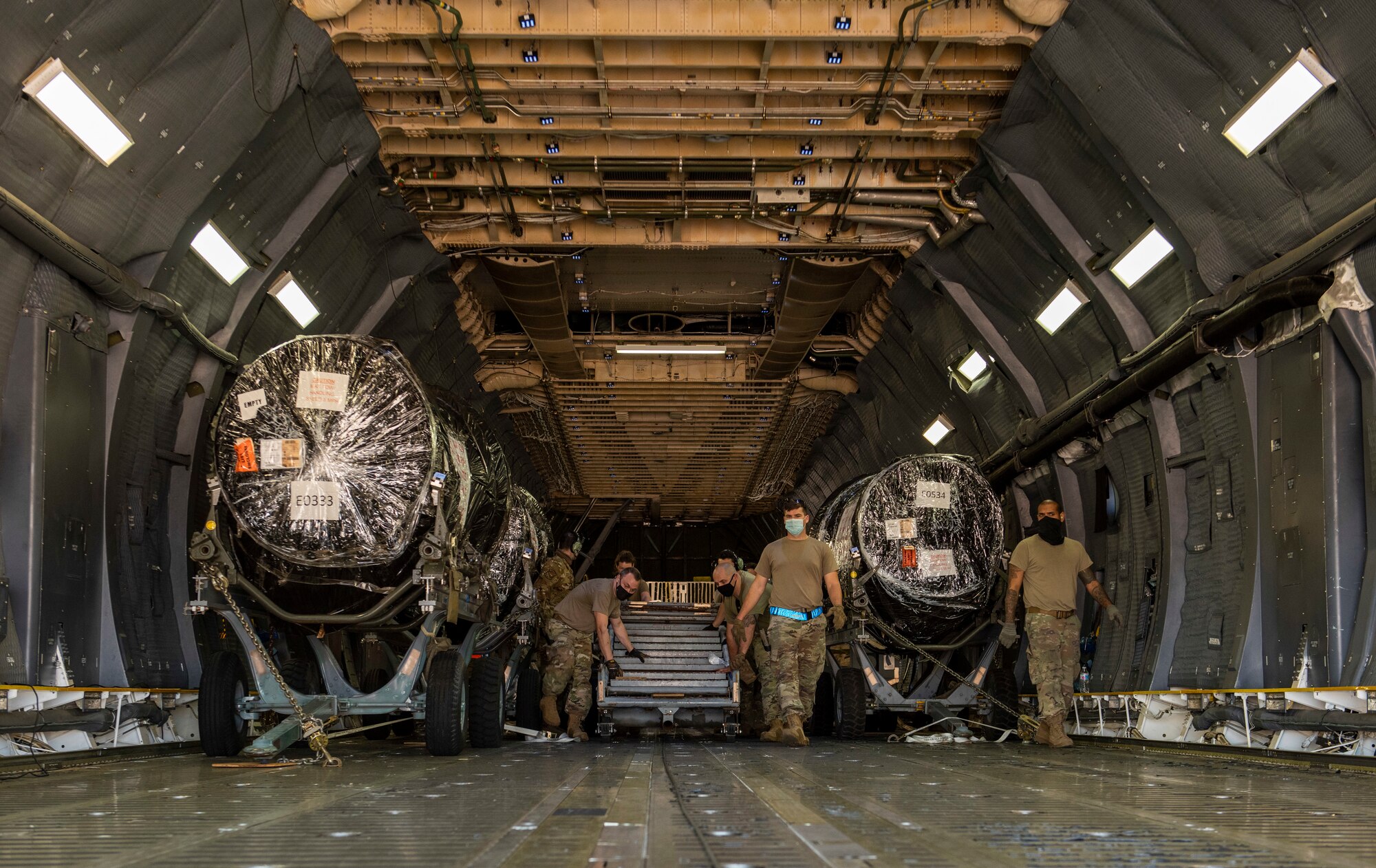 Airmen assigned to the 7th Logistics Readiness Squadron air transportation function prepare to unload cargo at Dyess Air Force Base, Texas, Nov. 25, 2020.