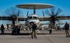 U.S. Navy Airmen prepare an aircraft for take-off.