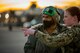 U.S. Navy Airmen talk on the flight line.