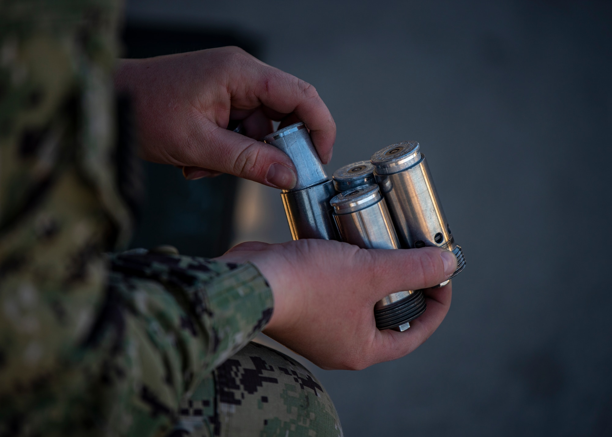 U.S. Navy Airman performs maintenance.