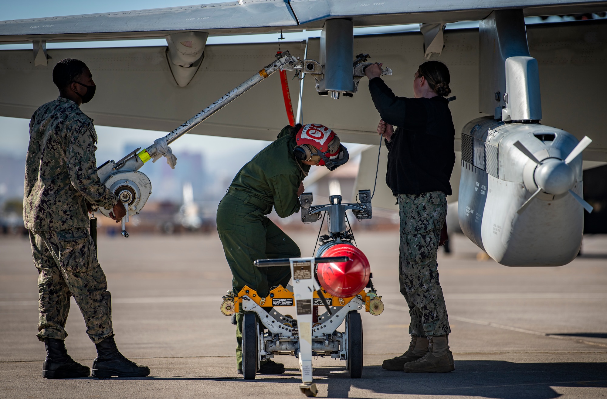 U.S. Navy Airmen work on aircraft