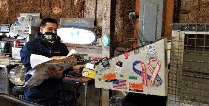 Jimmy Murphy, a City of Altus employee at the 97th Air Mobility Wing Recycling Center on Altus Air Force Base, Oklahoma, prepares to shred paper Dec. 10, 2020. All paper turned in at the recycling center is shredded and baled before being transported. (U.S. Air Force photo by Judy Mott)
