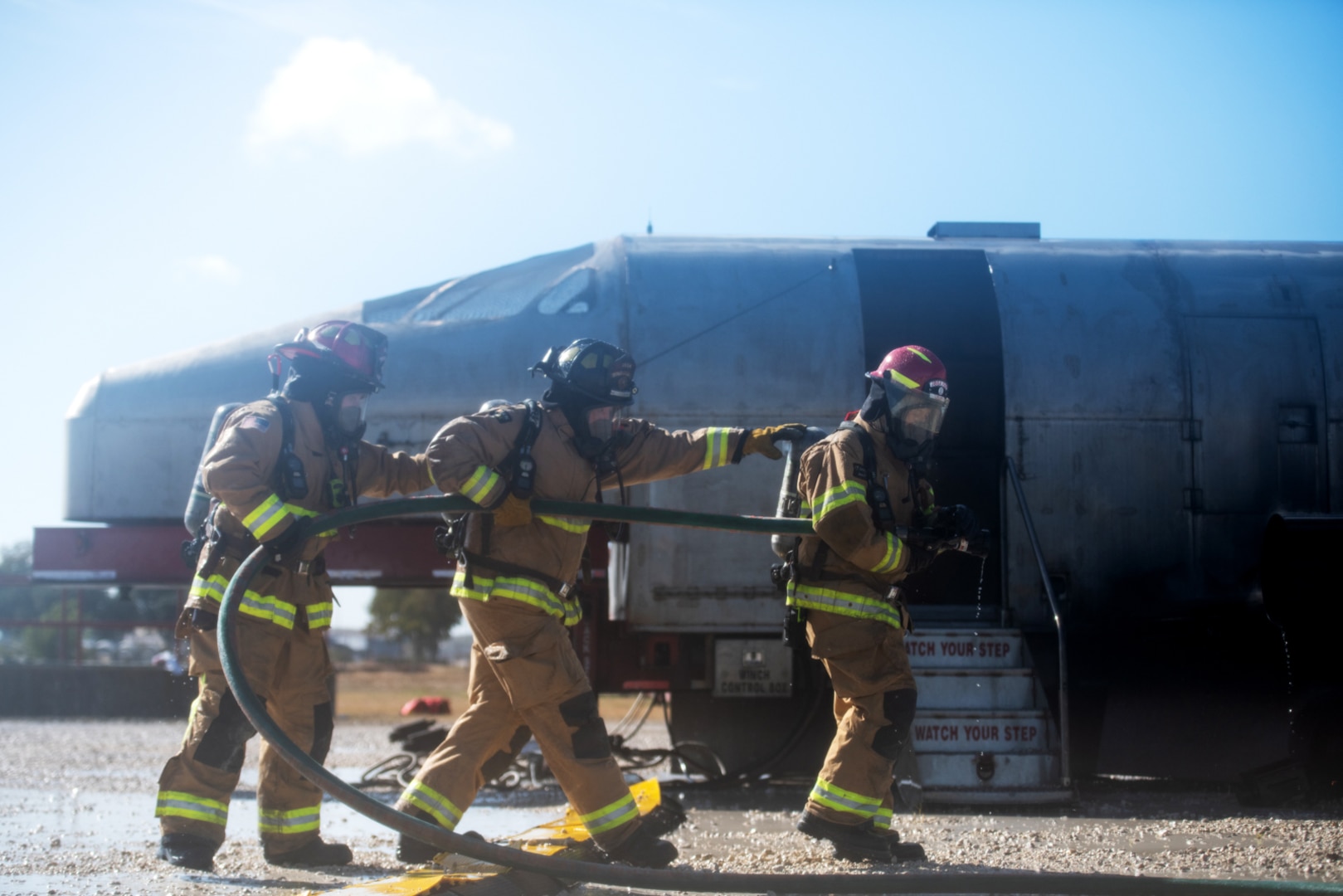 Firefighters with Joint Base San Antonio extinguish an isolated fire during a live fire Aircraft Rescue Fire Fighting training Nov. 20, 2020, at Joint Base San Antonio-Lackland Kelly Field Annex.