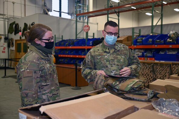 airman tries on female body armor