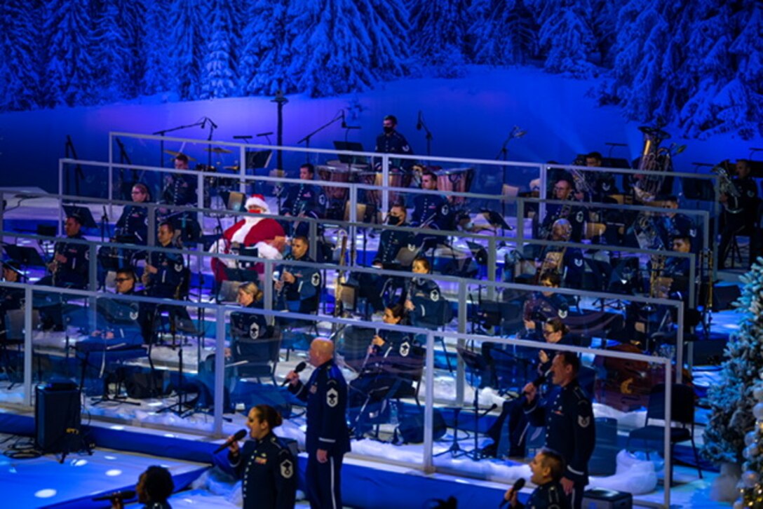 The U.S. Air Force Concert Band and Singing Sergeants perform during their holiday special, “Season of Hope,” while Santa look on at the MGM National Harbor. (U.S. Air Force Photo by Chief Master Sgt. Kevin Burns)