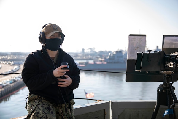 Aviation Ordnanceman 3rd Class Courtney Cruse confirms working communications using a sound-powered phone aboard the Wasp-class amphibious assault ship USS Kearsarge (LHD 3) Dec. 10, 2020.