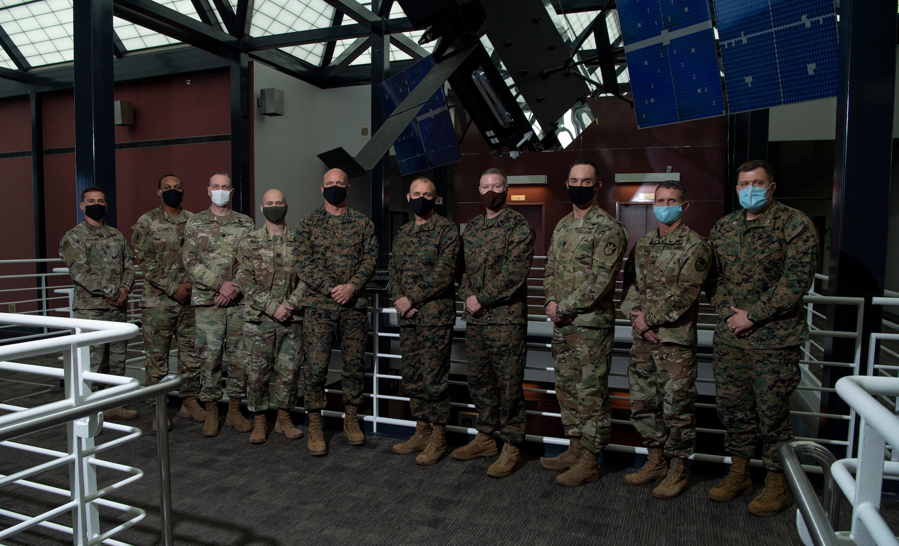 U.S. Marine Corps Maj. Gen. Matthew Glavy (sixth from left), Marine Corps Forces Space and U.S. Marine Corps Forces Cyberspace commands commander, visited U.S. Space Command on Dec. 10 and 11 with a contingent of Marine Corps officers, including Gen. Gary Thomas, assistant commandant of the Marine Corps, at Peterson Air Force Base, Colorado. Glavy met with USSPACECOM leaders, including its two top-ranking Marines, Brig. Gen. Joseph Matos (fifth from left) and Master Gunnery Sgt. Scott Stalker (seventh from left), USSPACECOM command senior enlisted leader.