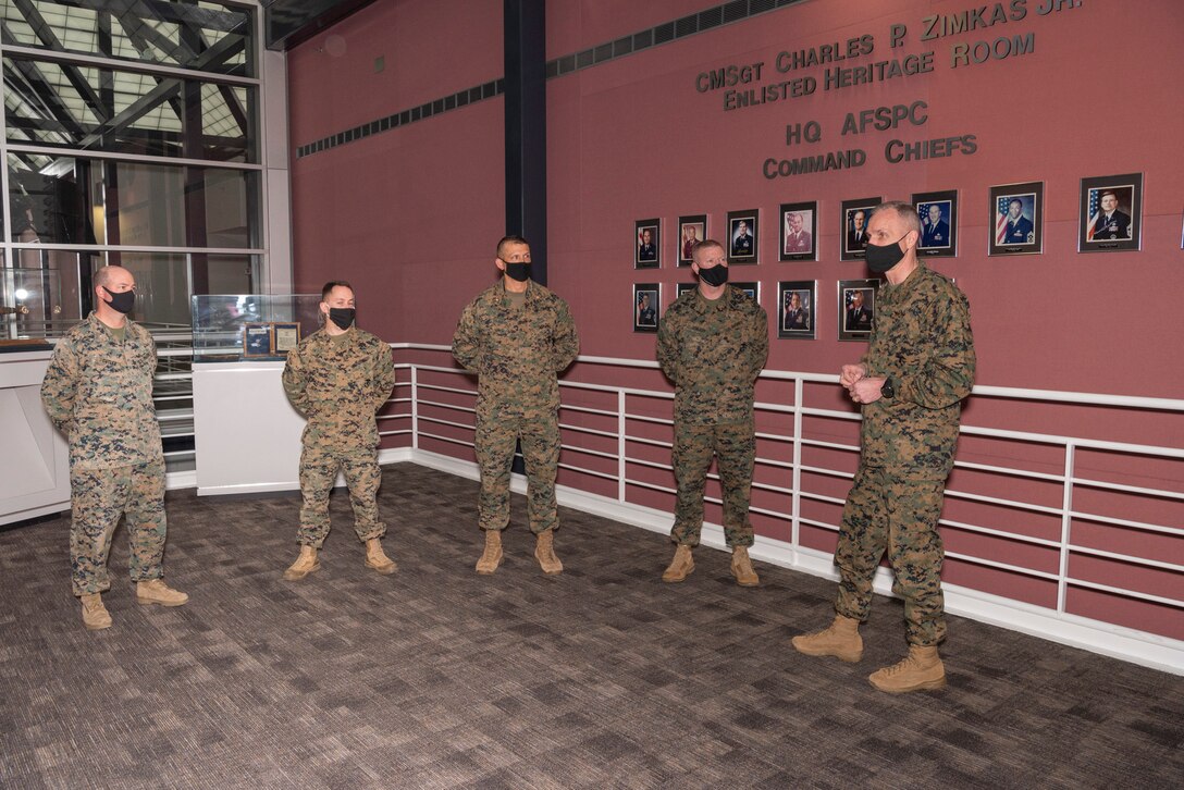 Gen. Gary Thomas (right), assistant commandant of the U.S. Marine Corps, talks with Marines of U.S. Space Command on Dec. 11, 2020, at the combatant command’s headquarters at Peterson Air Force Base, Colorado.