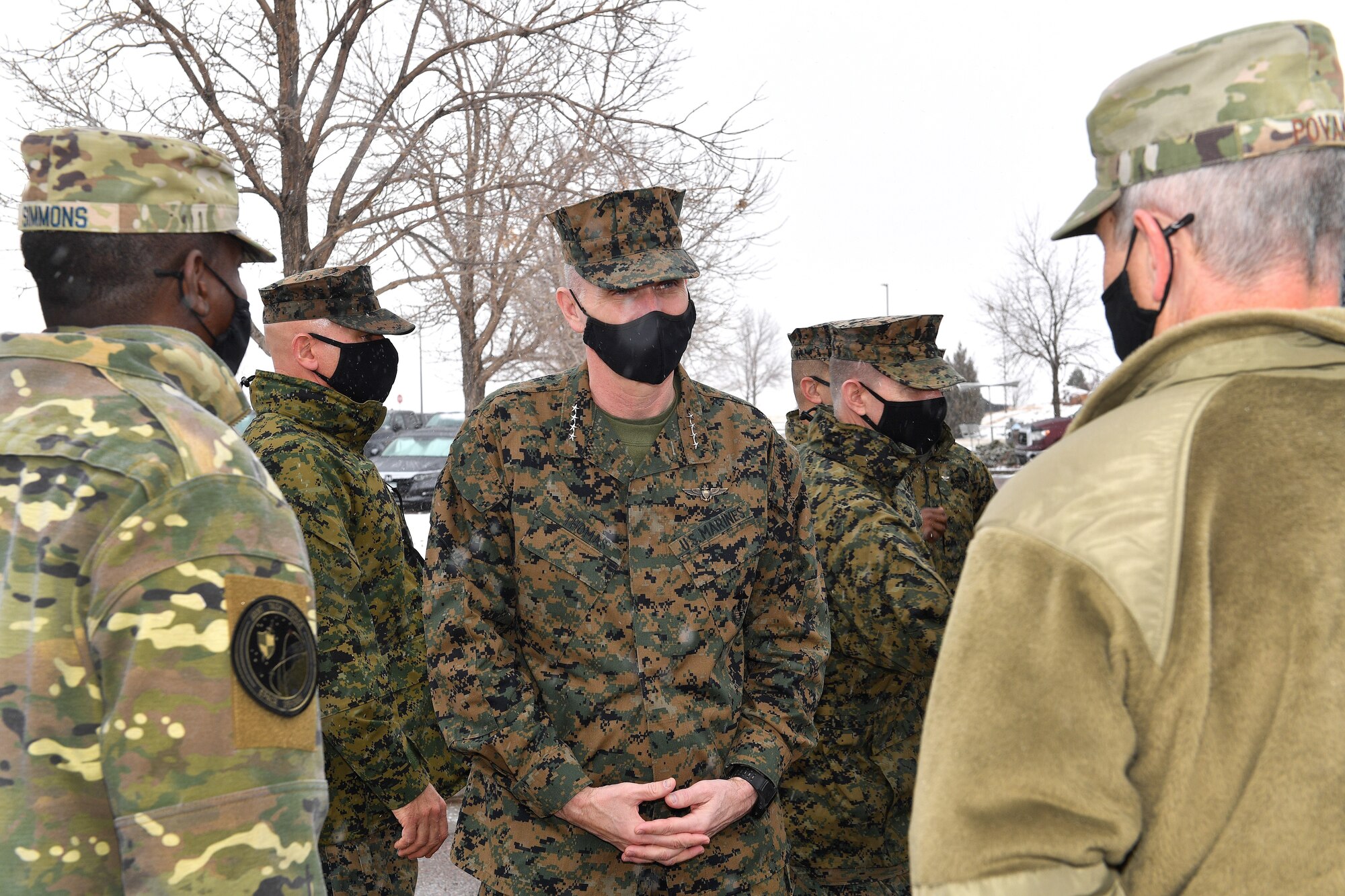 Air Force Brig. Gen. Christopher Povak, Joint Task Force-Space Defense deputy commander, and Chief Master Sgt. Jacob Simmons, JTF-SD command senior enlisted leader, welcome Gen. Gary Thomas, assistant commandant of the U.S. Marine Corps, to Schriever Air Force Base, Colorado, on Dec. 11, 2020.  The JTF-SD leaders briefed the general on space threats and the JTF-SD’s role in support of U.S. Space Command missions during his visit to the installation.