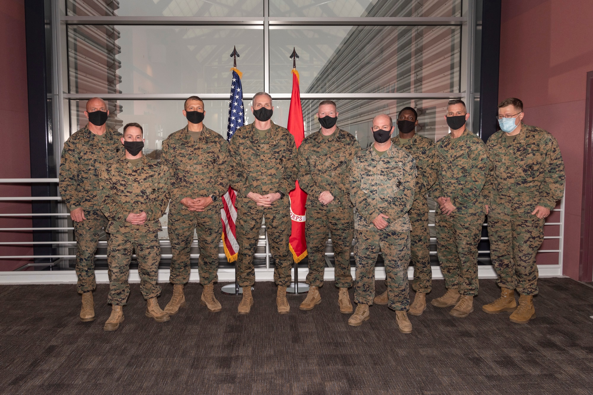 Gen. Gary Thomas (fourth from left), assistant commandant of the U.S. Marine Corps, talks with Marines of U.S. Space Command, including Brig. Gen. Joseph Matos (far left) and Master Gunnery Sgt. Scott Stalker (fifth from left) on Dec. 11, 2020, at the combatant command’s headquarters at Peterson Air Force Base, Colorado.