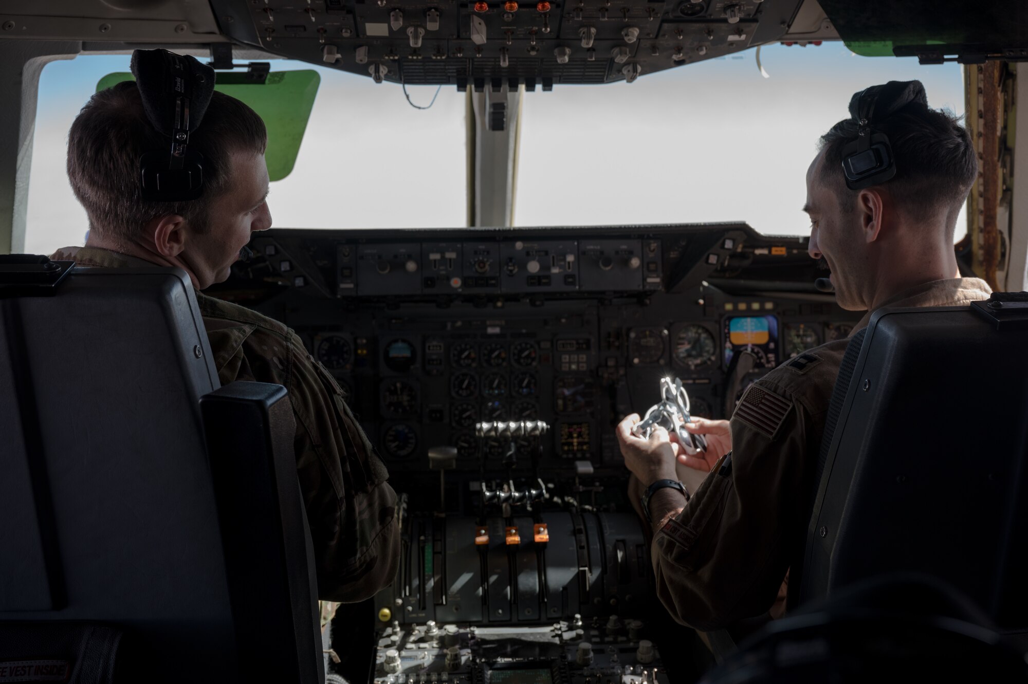 U.S. Air Force pilots assigned to the 908th Expeditionary Air Refueling Squadron fly a KC-10 Extender in the U.S. Central Command area of responsibility Dec. 10, 2020.  The KC-10 Extender delivers U.S. Air Forces Central a global reach air refueling capability to support joint and partner nation air assets  throughout the U.S. CENTCOM area of responsibility.  (U.S. Air Force photo by Staff Sgt. Sean Carnes)