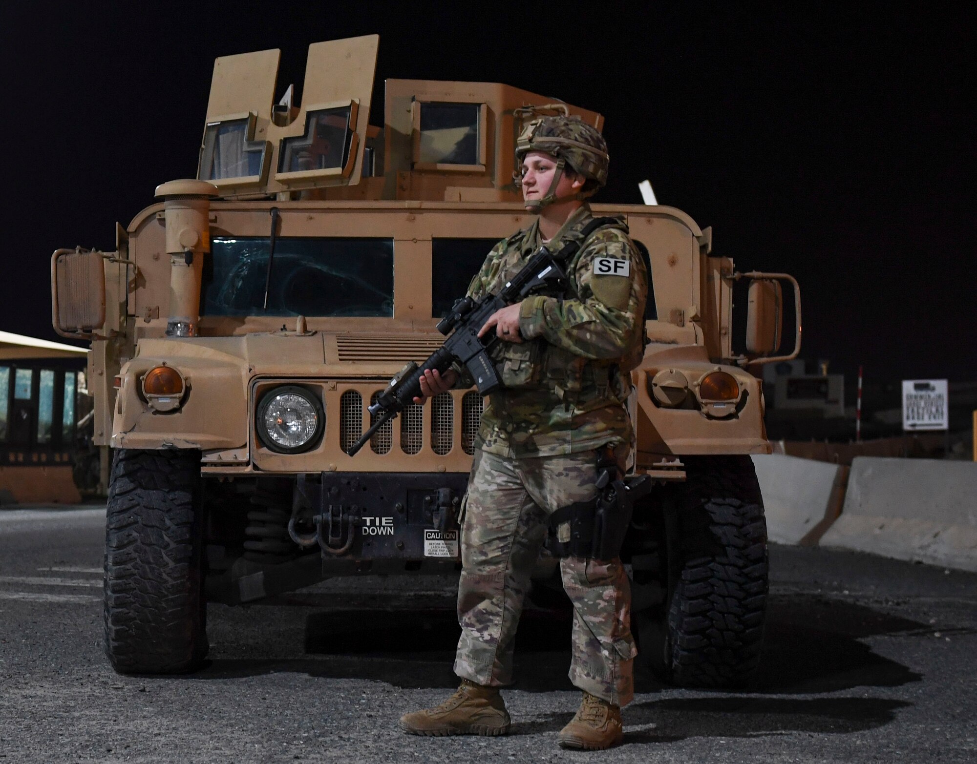 U.S. Air Force Staff Sgt. Karleigh Marin, 386th Expeditionary Security Forces Squadron response force leader, monitors the surrounding area during the Marauder 21-02 exercise at Ali Al Salem Air Base, Kuwait, Dec. 8, 2020. The exercise tested the 386th Air Expeditionary Wing’s response to elevated Force Protection Condition levels. (U.S. Air Force photo by Senior Airman Monica Roybal)