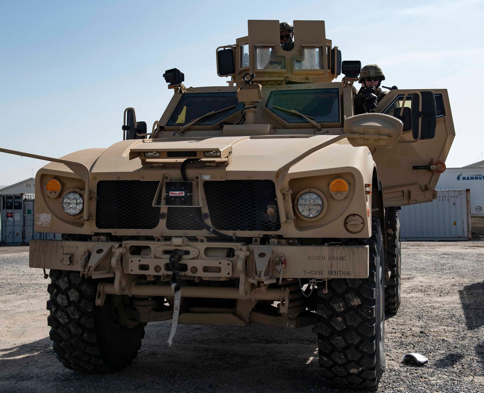 U.S. Air Force Senior Airmen Kenneth Hunter, 386th Expeditionary Security Forces Squadron response force member, mans an M240 machine gun in the turret of a mine-resistant ambush protected all-terrain Vehicle, or M-ATV, while Staff Sgt. Matthew Pigmon, 386th ESFS response force leader, prepares the vehicle before patrolling the perimeter at Ali Al Salem Air Base, Kuwait, Dec. 9, 2020. The turret in the M-ATV can be outfitted with an array of weapons, including the M240 machine gun, M249 light machine gun, and more. (U.S. Air Force photo by Staff Sgt. Kenneth Boyton)