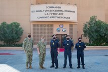 Royal Navy Adm. Tony Radakin, center, First Sea Lord and Chief of the Naval Staff, Vice Adm. Samuel Paparo, center left, commander of U.S. Naval Forces Central Command (NAVCENT), U.S. 5th Fleet and Combined Maritime Forces (CMF), Cdre. Dean Bassett, center right, deputy commander of CMF, Cdre. Craig Wood, right, commander of Coalition Task Force (CTF) Sentinel and Rear Adm. Curt Renshaw, deputy commander of  NAVCENT, pose in front of the NAVCENT headquarters onboard Naval Support Activity Bahrain, Dec. 10. NAVCENT is the U.S. Navy element of U.S. Central Command in the U.S. 5th Fleet area of operations, which encompasses about 2.5 million square miles of water area and includes the Arabian Gulf, Gulf of Oman, Red Sea and parts of the Indian Ocean. The expanse is comprised of 20 countries and includes three critical choke points at the Strait of Hormuz, the Suez Canal and the Strait of Bab al Mandeb at the southern tip of Yemen.