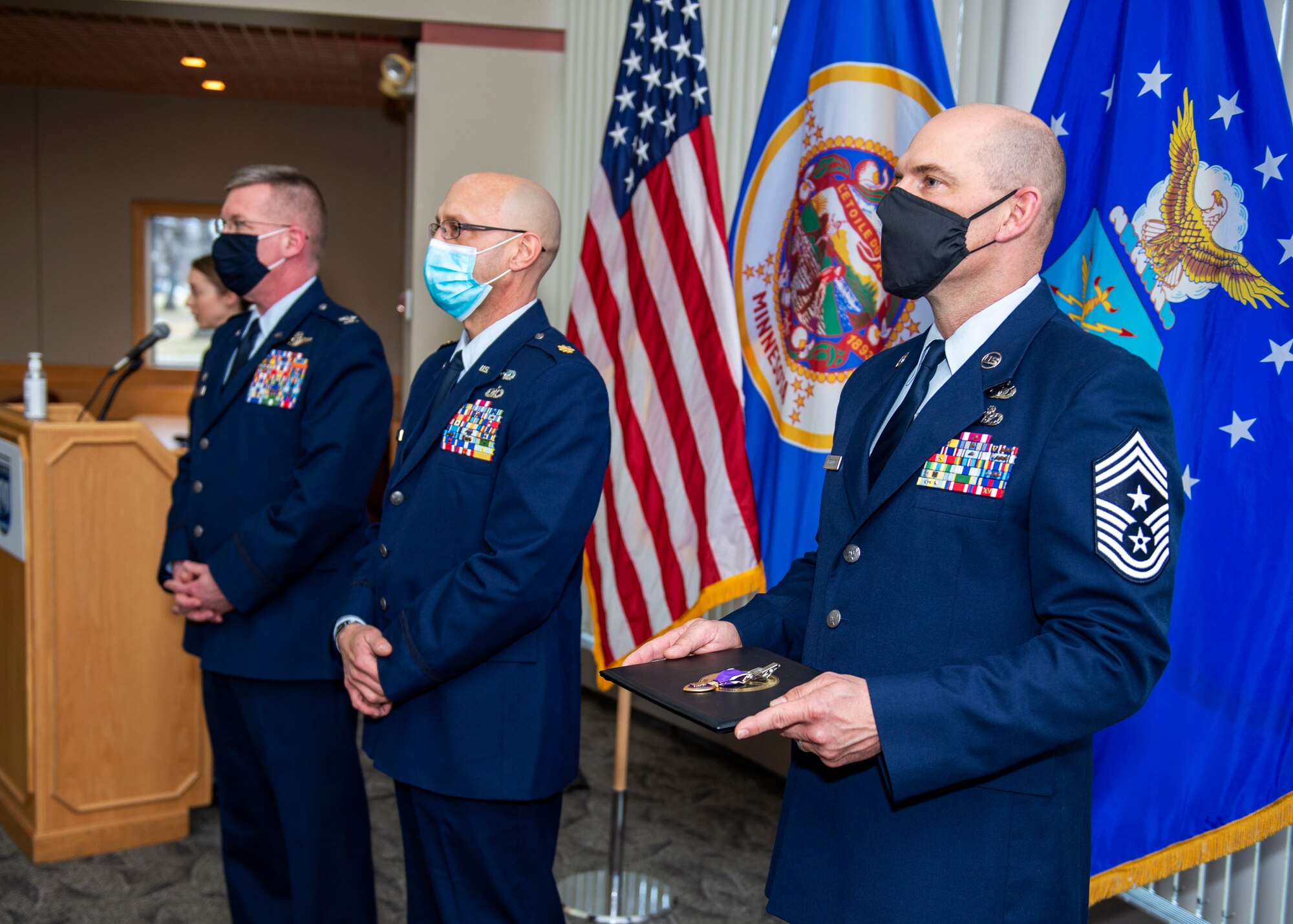 U.S. Air Force Maj. Allen Thill receives the Purple Heart award after sustaining injuries during his most recent deployment to Iraq in St. Paul, Minn., Dec. 12, 2020.