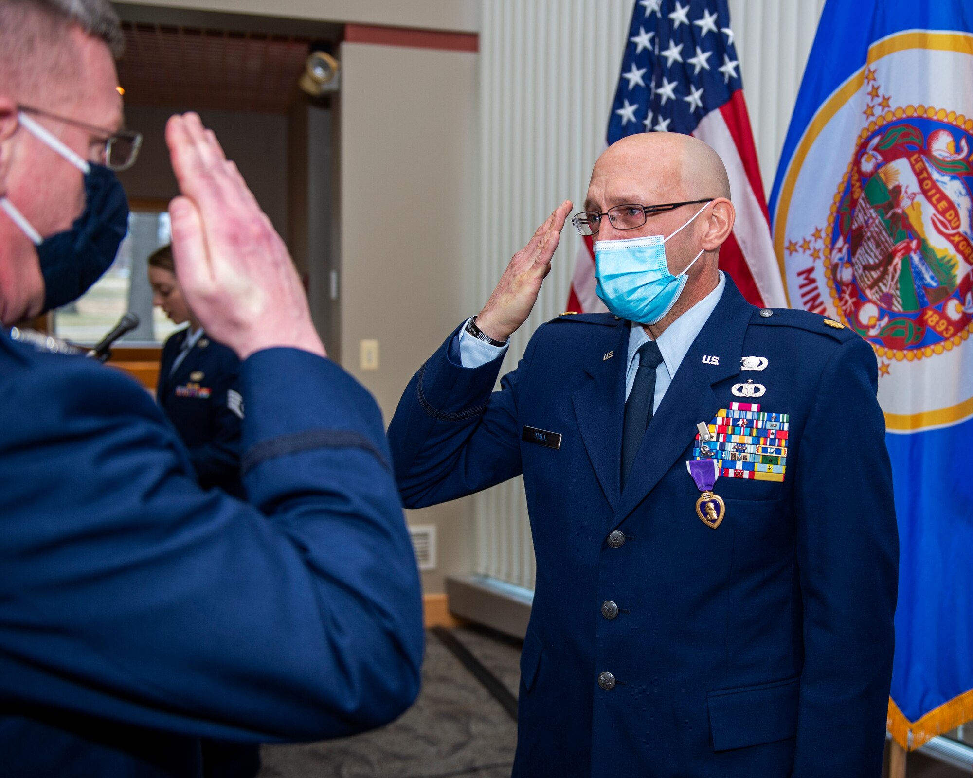 U.S. Air Force Maj. Allen Thill receives the Purple Heart award after sustaining injuries during his most recent deployment to Iraq in St. Paul, Minn., Dec. 12, 2020.
