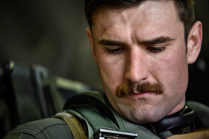 A fighter pilot prepares for flight.
