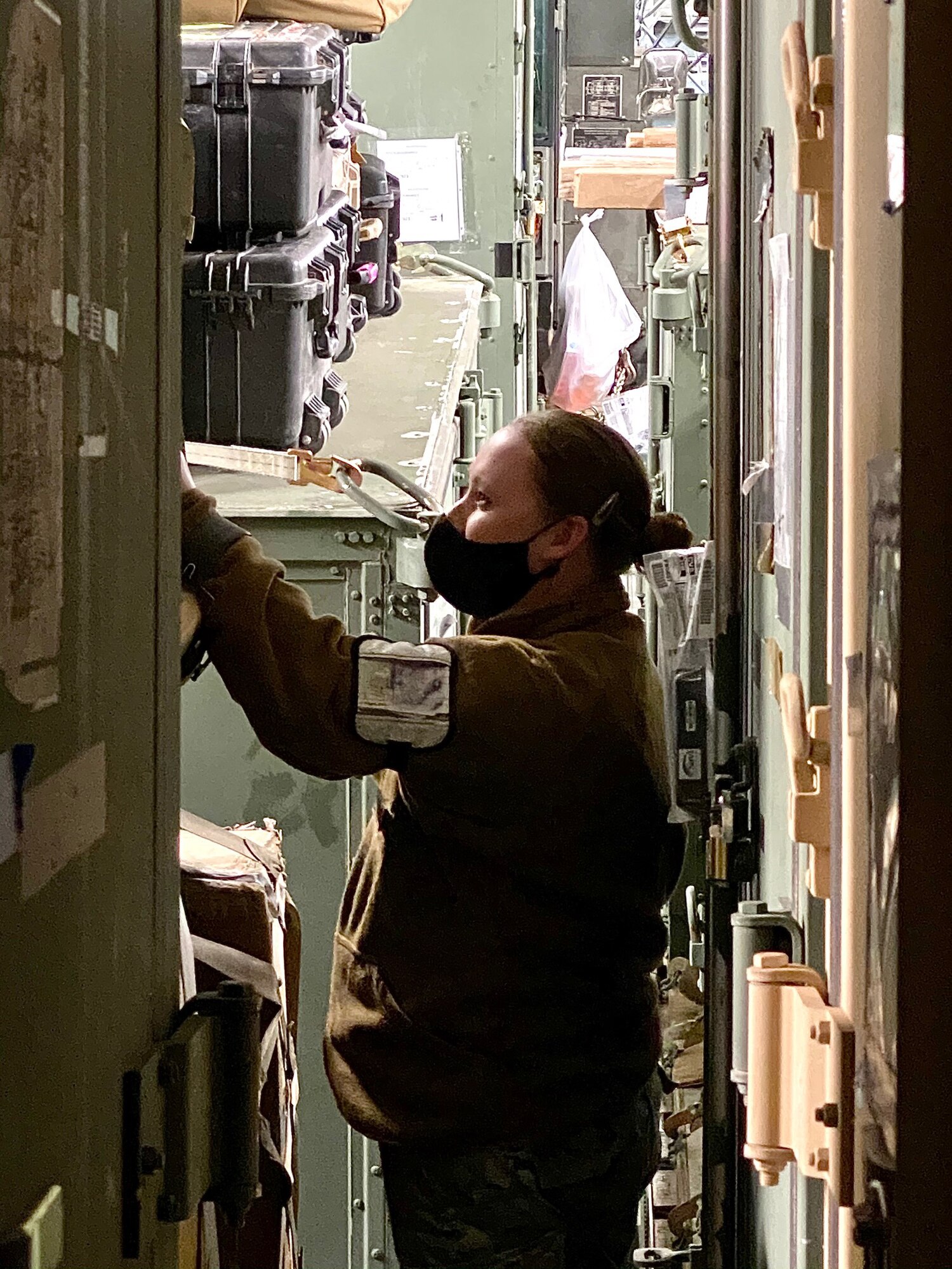 An Airman searches cargo.