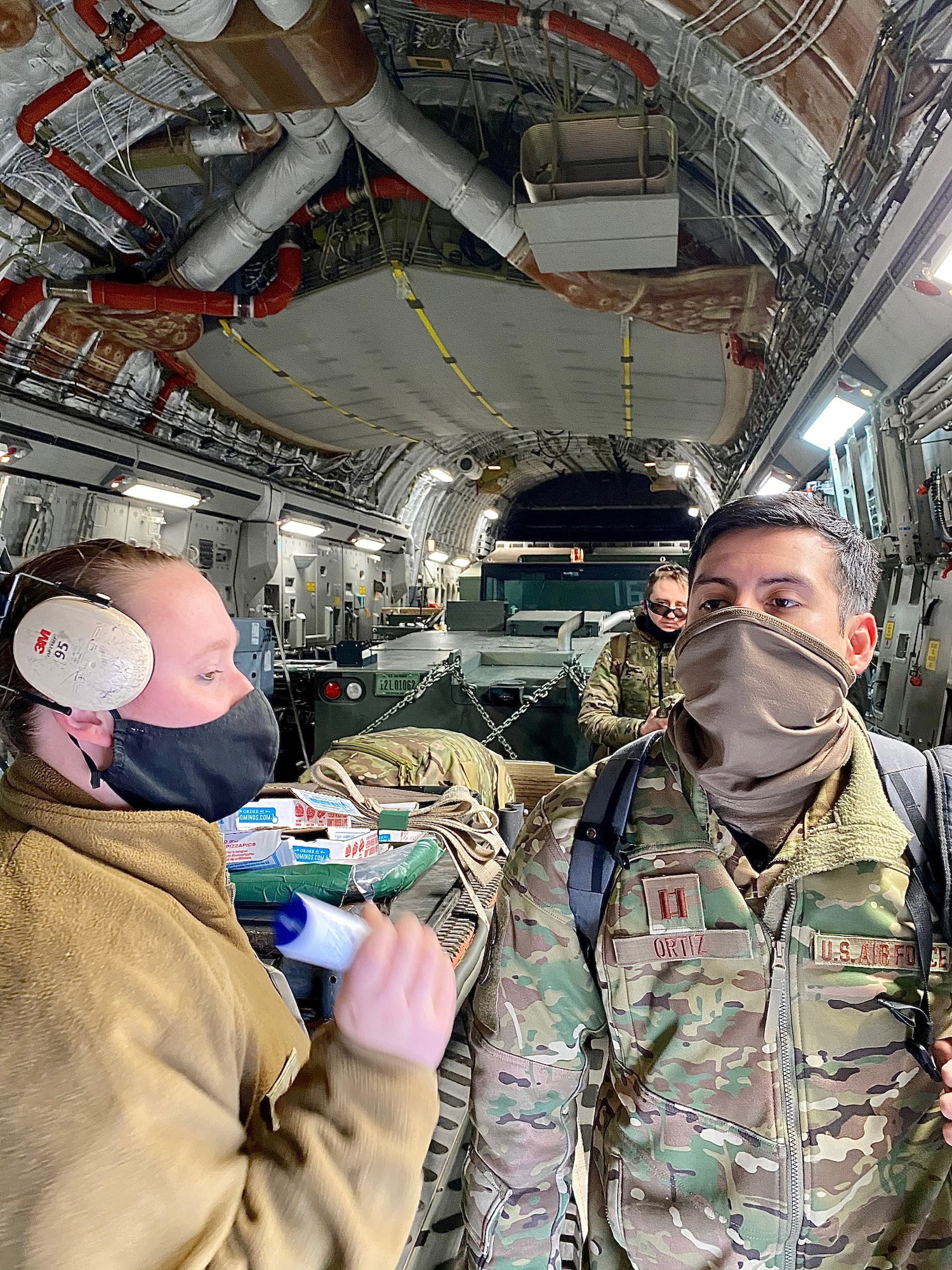 An Airman screens a passenger.