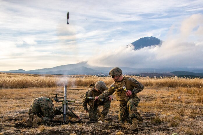 U.S. Marines fire an M224A1 60mm mortar system for a live-fire range  at Combined Arms Training Center, Camp Fuji, Japan, Dec. 9.