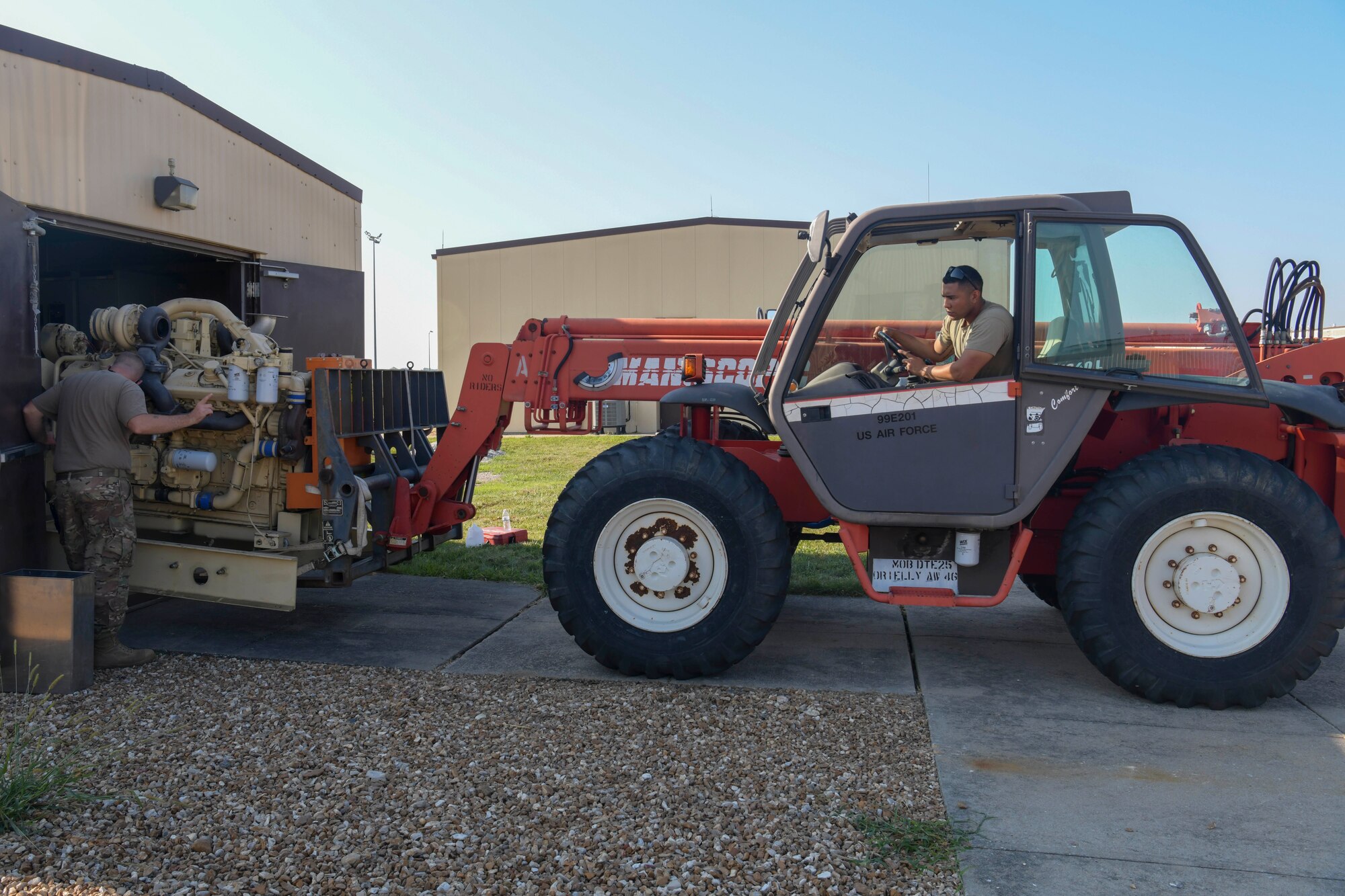 U.S. Air Force Senior Airman Labyron Padilla, 509th Civil Engineer Squadron electrical systems journeyman, removes an old generator at Whiteman Air Force Base, Missouri, Aug. 25, 2020. The old generator was replaced by a new generator that provides backup power to the fuel pumps that provide fuel to the B-2 Spirit. (U.S. Air Force photo by Staff Sgt. Dylan Nuckolls)