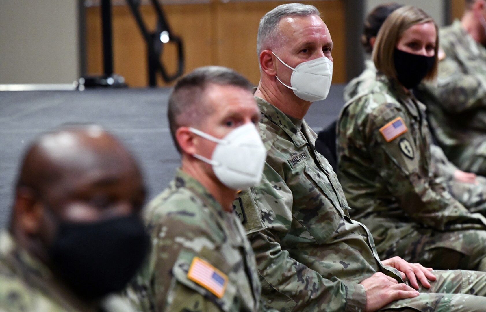 Maj. Gen. Dennis LeMaster and others members of the panel listen as Soldiers asks a question on the Army Combat Fitness Test.