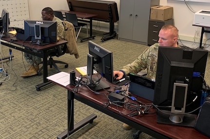 Staff Sgt. Vito Lyde of the South Carolina National Guard (left) and Staff Sgt. Max Sanford of the North Dakota National Guard, instructors with the new Army National Guard-Forward Virtual Basic Leadership Course, teach a class from the 166th Regiment Regional Training Institute at Fort Indiantown Gap, Pa.