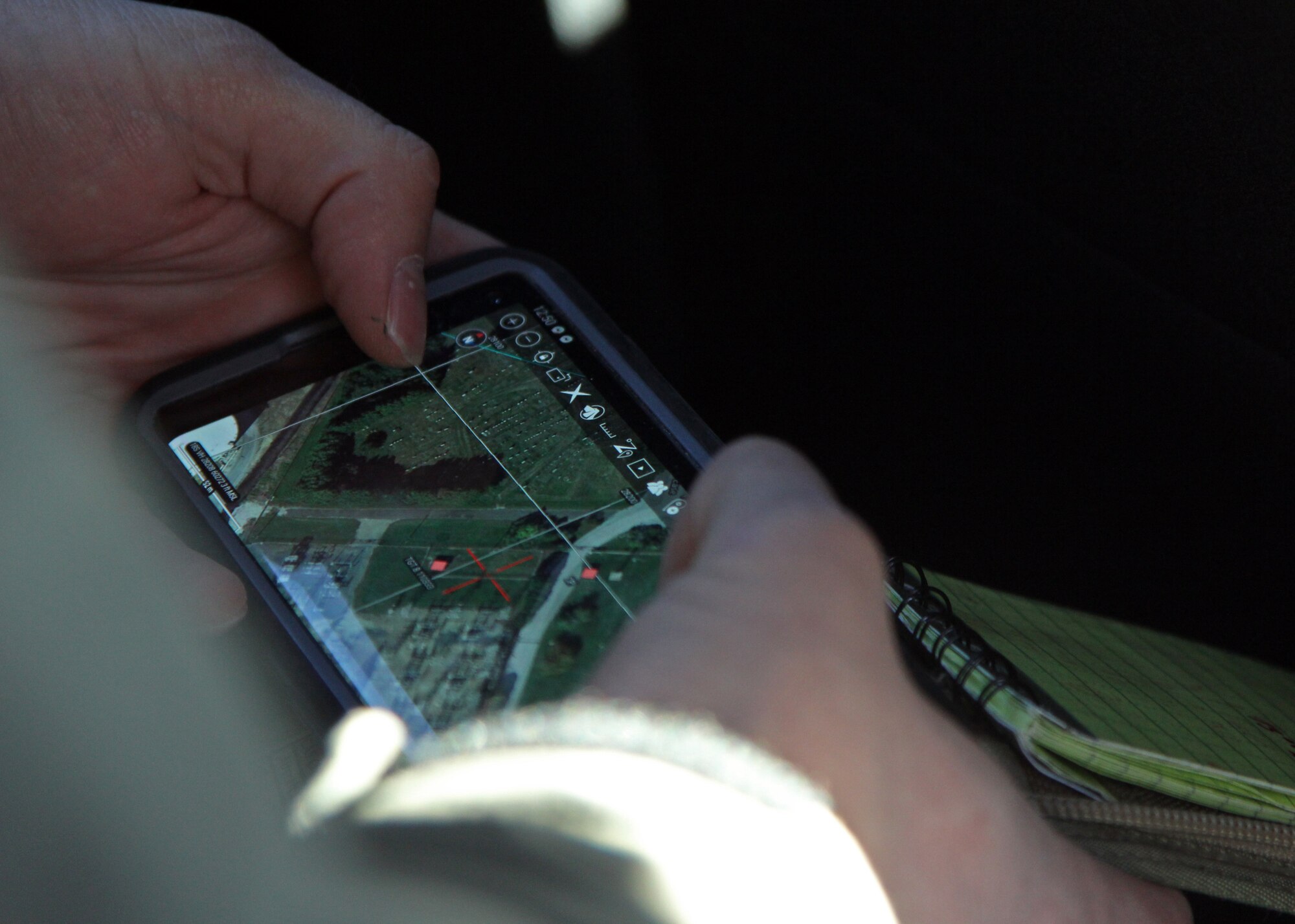 A joint terminal attack controller from the Estonian Defense Force practices using mapping software to get target locations to pass on to an A-10C Thunderbolt II aircraft assigned to 104th Fighter Squadron, Maryland Air National Guard, during close air support training in Vienna, Maryland, on Dec. 8, 2020.