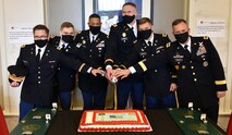 Lt. Gen. Daniel L. Karbler, right, commanding general, U.S. Army Space and Missile Defense Command, participates in a ceremonial cake cutting with four graduating University of Alabama ROTC cadets following their commissioning into the Army during the Crimson Tide Battalion Fall 2020 Commissioning Ceremony, Dec. 11. From left are: 2nd Lt. Tucker A. Arnett; 2nd Lt. Matthew T. Fagg; Lt. Col. Antwan D. Brown, professor of military science; 2nd Lt. Noah T. Kren; 2nd Lt. Terry L. Hancock; and Karbler. (U.S. Army photo by Jason B. Cutshaw)