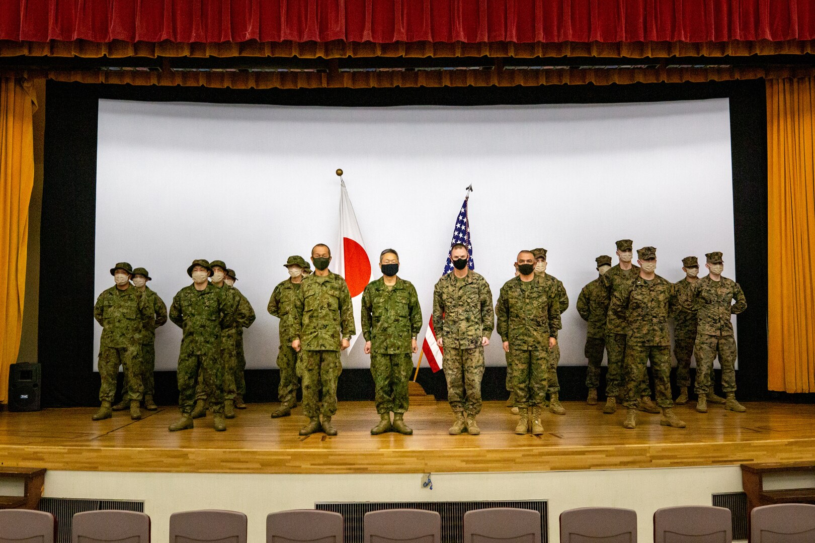 Japan Ground Self-Defense Force Warrant Officer Masanobu Murawaki, command sergeant major of the Amphibious Rapid Deployment Brigade, left, Maj. Gen. Takanori Hirata, commander of the Amphibious Rapid Deployment Brigade, and U.S. Marine Corps Brig. Gen. Kyle B. Ellison, commanding general of 3D Marine Expeditionary Brigade, and Sgt. Maj. Adan Moreno, sergeant major of 3D Marine Expeditionary Brigade conduct the opening ceremony of Exercise Yama Sakura 79 on Camp Courtney, Okinawa, Japan, Dec. 8, 2020. Yama Sakura 79 allows Marines, and their Japanese counterparts to maintain their interoperability, and readiness to respond to any crisis or contingency in the Indo-Pacific region.